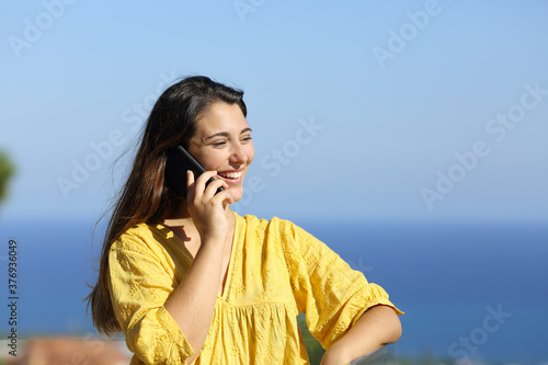 Happy woman calling on phone