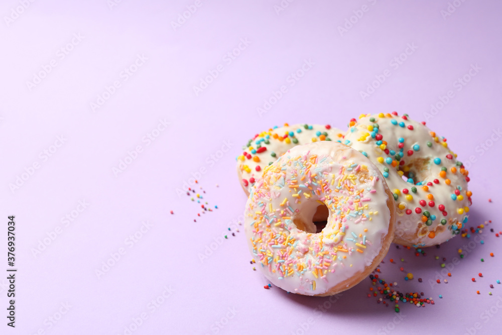 Tasty donuts on blue background, close up Tasty donuts on blue background, close up