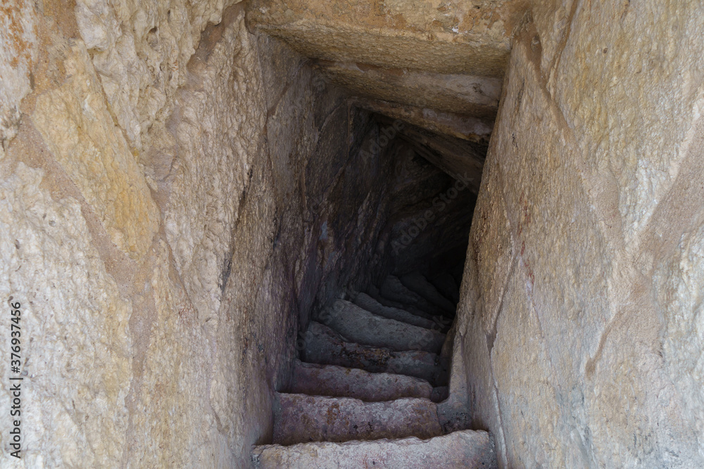 Passage with stairs between levels of medieval tower. Shot in fortress Kizkalesi, province Mersin, Turkey.