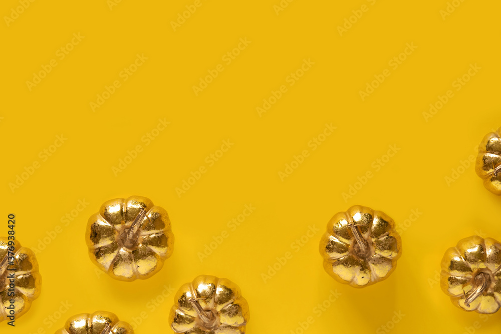 Autumn fall thanksgiving day composition with decorative golden pumpkins. Copy space. Top view. Autumn fall thanksgiving day composition with decorative golden pumpkins. Copy space. Top view.