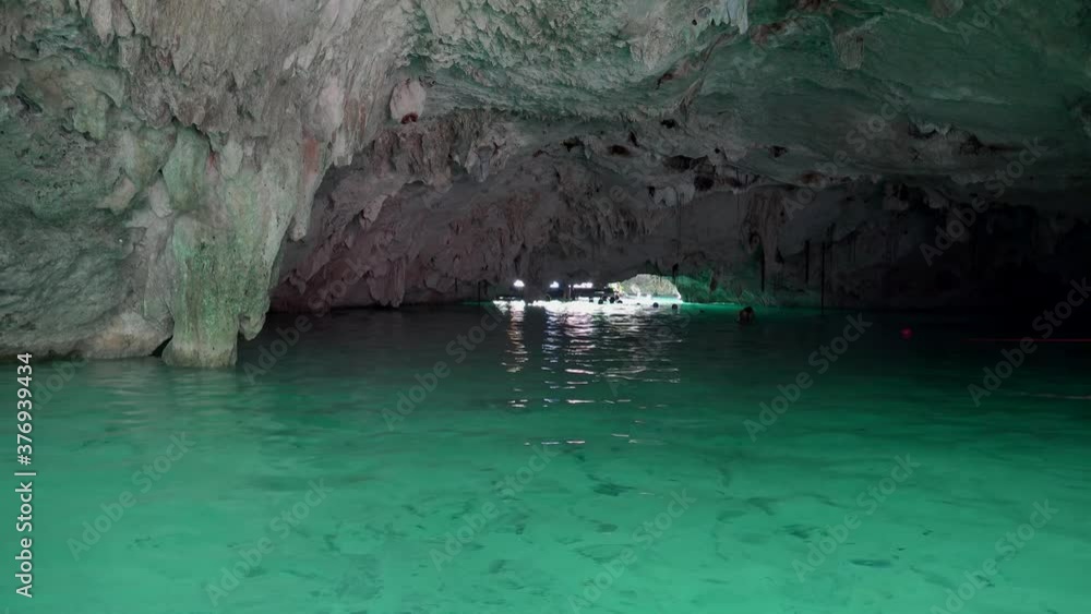 Tourists in the Grand Senote (Sac Actun underwater cave system). Tulum, Mexico Tourists in the Grand Senote (Sac Actun underwater cave system). Tulum, Mexico