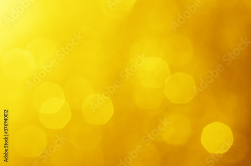 glitter light sparkle yellow golden gorgeous bokeh defocused abstract background shiny. © thithawat