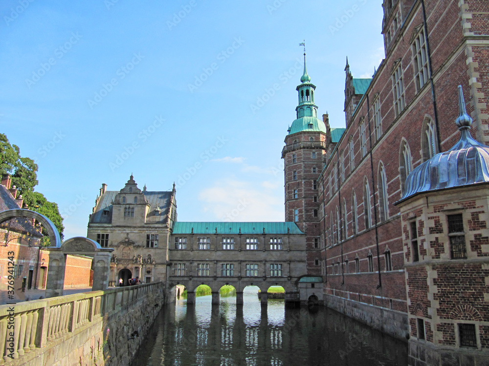 Red brick scandinavian castle on the lake, Denmark