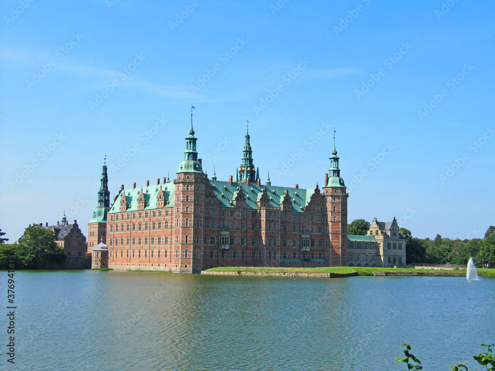 Red brick scandinavian castle on the lake, Denmark Red brick scandinavian castle on the lake, Denmark