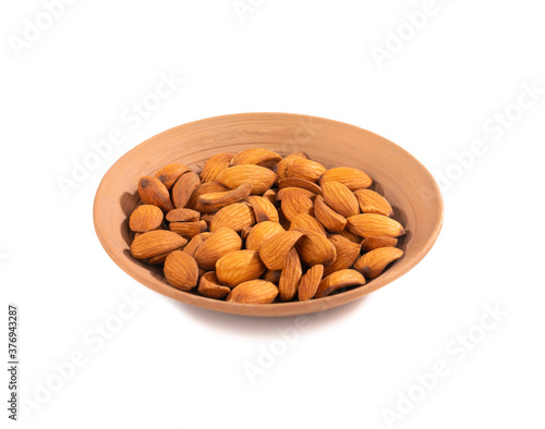 Almond in Bowl Isolated on White Background © Indian Creation
