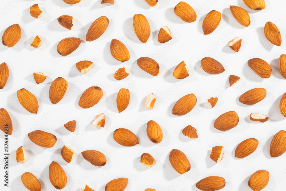Almond Pieces Broken Shell Nut Flying on White Background Almond Pieces Broken Shell Nut Flying on White Background