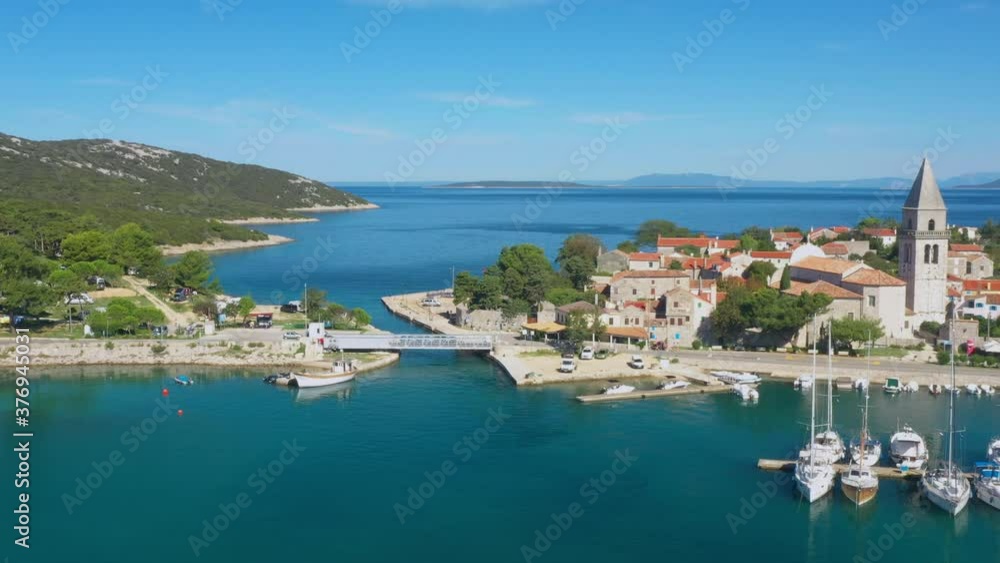 Beautiful old historic town of Osor, marina and bridge connecting islands Cres and Losinj, Croatia, aerial view from drone Beautiful old historic town of Osor, marina and bridge connecting islands Cres and Losinj, Croatia, aerial view from drone