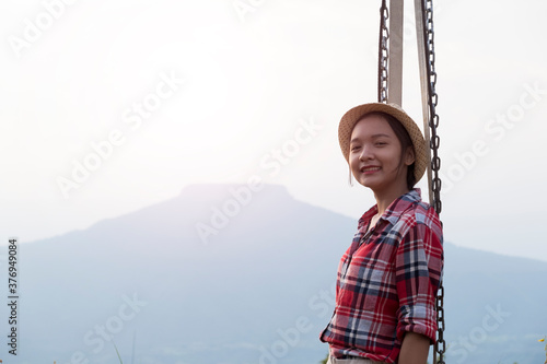 Happpy yoing girl at beautiful view point at Phu Pa Po Loei Thailand. photo