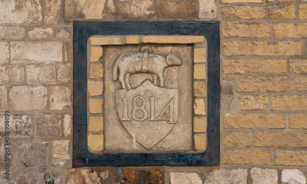 Nailsworth Mill - Old stone sign the only surviving symbol of Heskins and Barnard, clothiers and dyers, Nailsworth, England, United Kingdom Nailsworth Mill - Old stone sign the only surviving symbol of Heskins and Barnard, clothiers and dyers, Nailsworth, England, United Kingdom