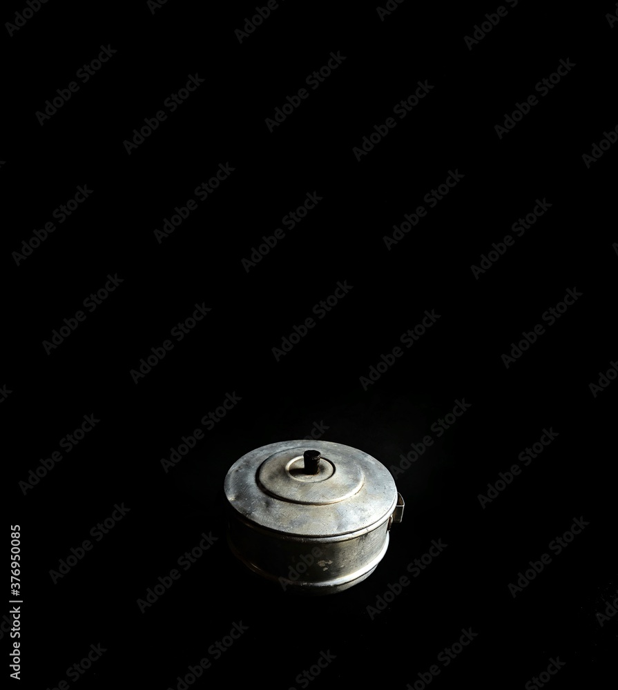 Old camping pot on black background. Cookware Old camping pot on black background. Cookware