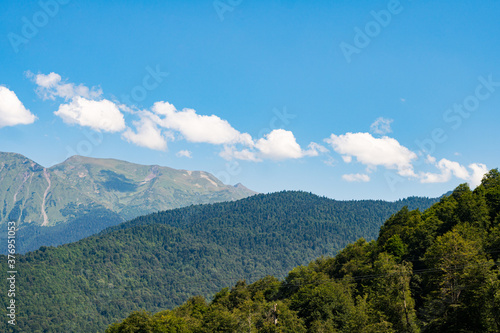 mountain landscape. Green mountains against a blue sky.