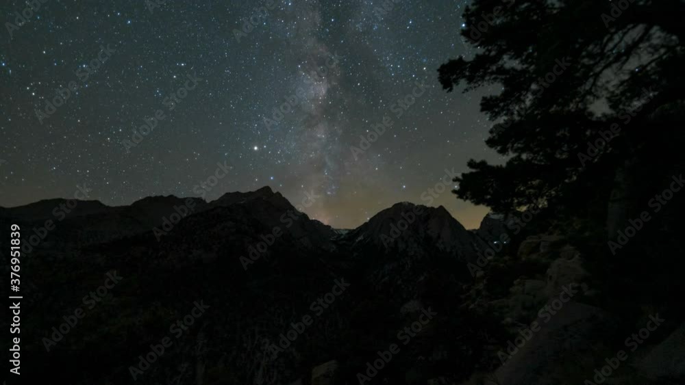 Astro timelapse tracking shot of Milky Way galaxy over Sierra Nevada Mountains in California Astro timelapse tracking shot of Milky Way galaxy over Sierra Nevada Mountains in California