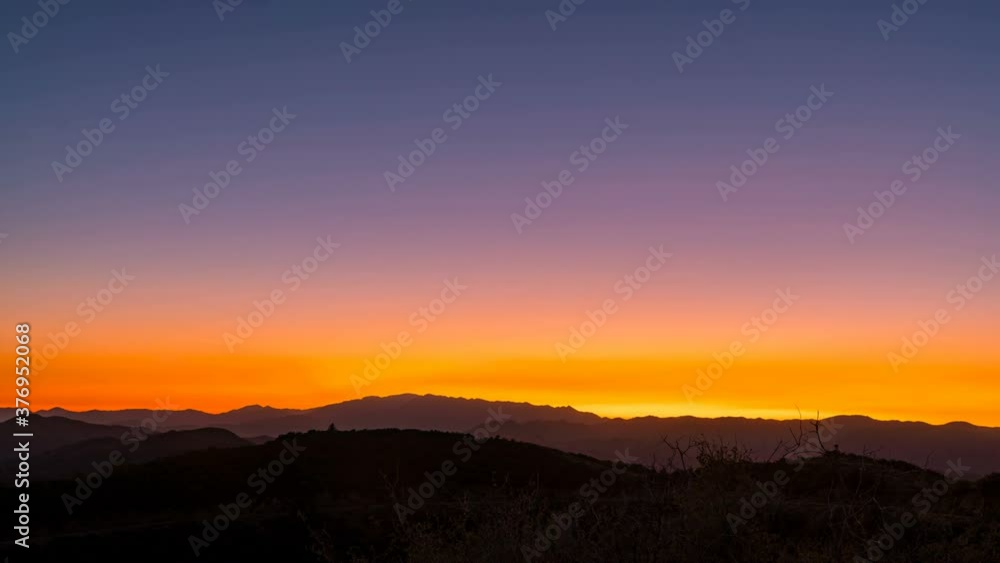 Timelapse of sunset afterglow over mountain range in Southern California Timelapse of sunset afterglow over mountain range in Southern California