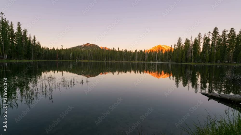  Time lapse tracking shot of sunrise at alpine lake at Lassen Volcanic National Park in California