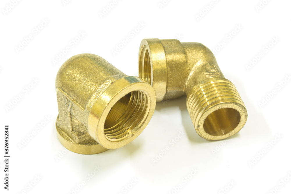 90 Degree brass elbow fitting on white background, Isolated. 90 Degree brass elbow fitting on white background, Isolated.