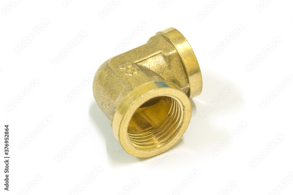 90 Degree brass elbow fitting on white background, Isolated. 90 Degree brass elbow fitting on white background, Isolated.