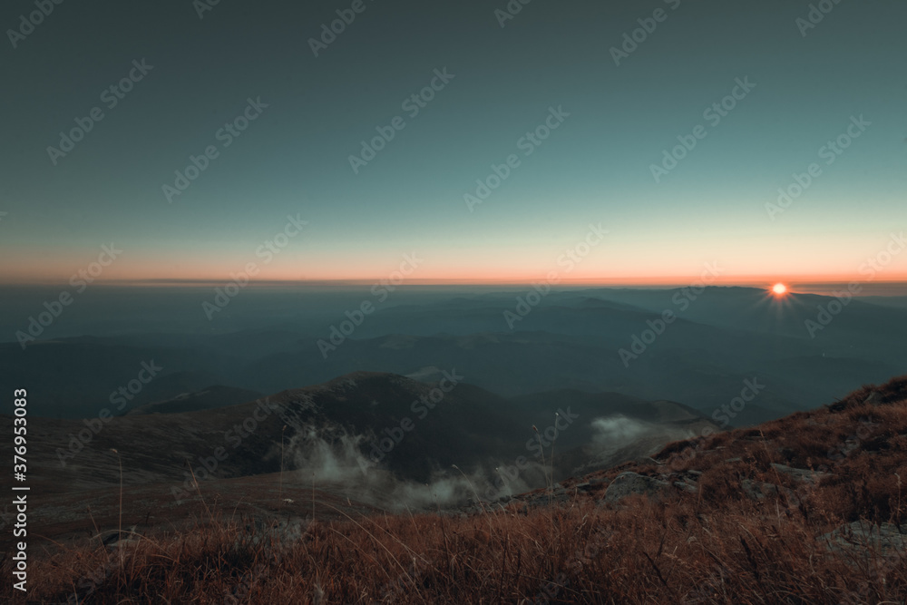 Beautiful sunset landscape from the mountains in autumn season