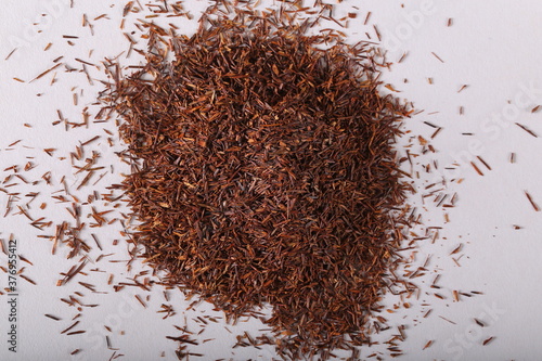 Aspalatus linearis dry tea lying on a white background photo