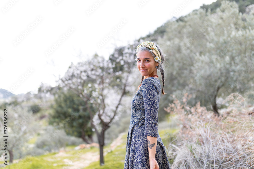 Naklejka premium Beautiful mid age women enjoying the nature.