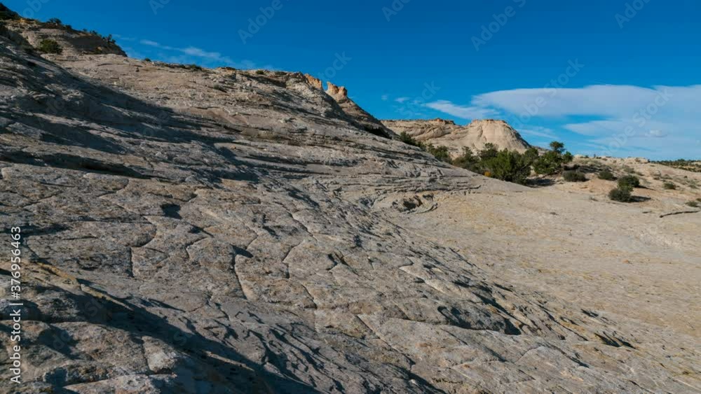 Time lapse of white bedrock formation at Head of the Rocks in Grand Staircase Escalante National Monument in Utah Time lapse of white bedrock formation at Head of the Rocks in Grand Staircase Escalante National Monument in Utah