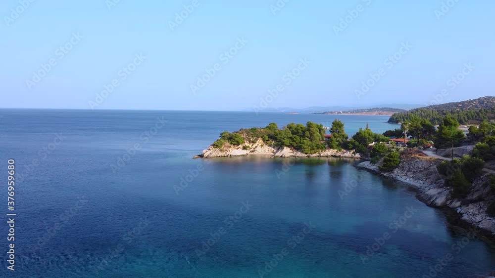 Aerial view of turquoise and clear  Aegean sea and coast in summertime