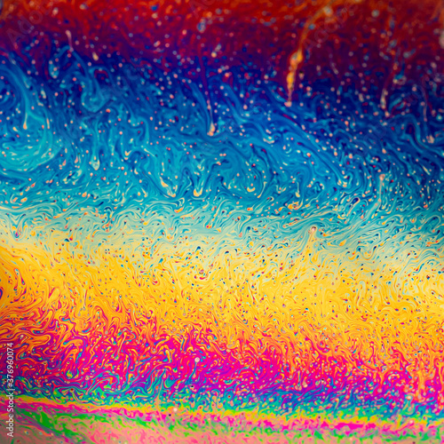 Multicolours as light refracts through liquid soap