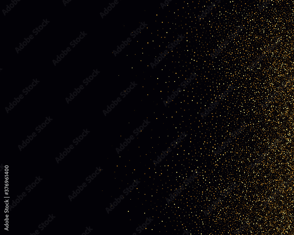 Gold glitter texture on a black background. Golden explosion of confetti. Golden grainy abstract texture on a black background. Design element