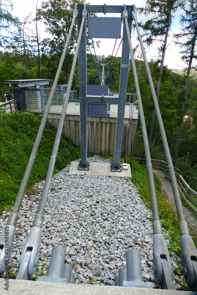 Anchorages and dowels in the rock for fixing the steel cables of the pedestrian suspension bridge with a length of 483 m above the Rappbode dam (Bode river) in Harz Mountains National Park, Germany Anchorages and dowels in the rock for fixing the steel cables of the pedestrian suspension bridge with a length of 483 m above the Rappbode dam (Bode river) in Harz Mountains National Park, Germany