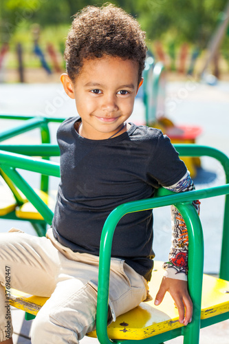 Portrait of little boy in autumn park photo