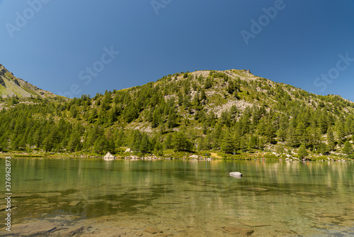 Morgex (Aosta), the wonderful Lake of Arpy, a mirror of water of glacial origin set in a beautiful alpine setting.