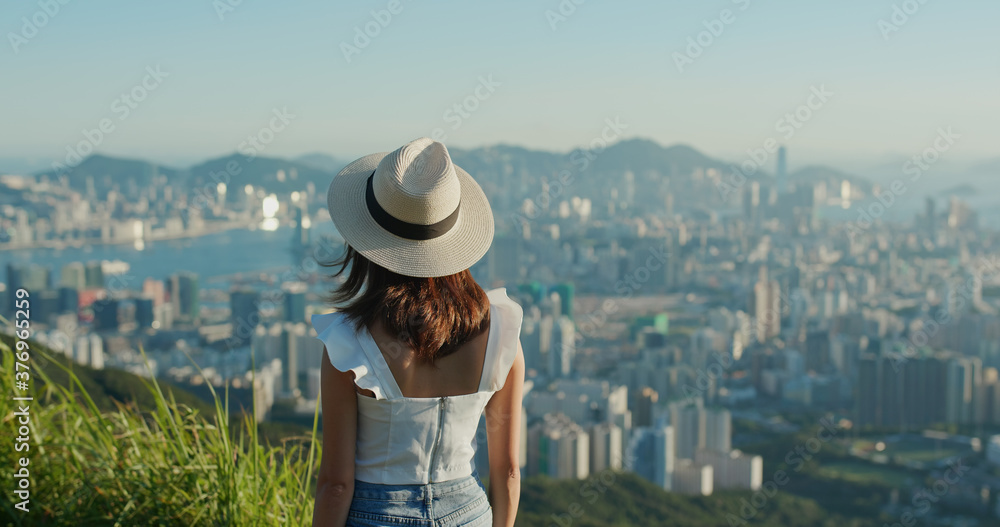 Woman enjoy the city view on mountain