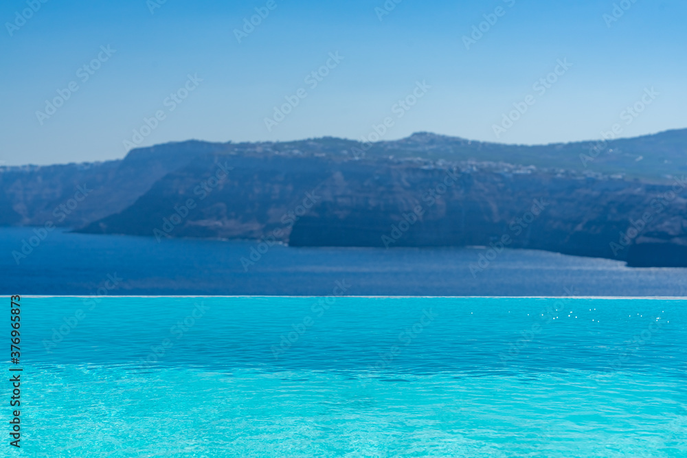 Fototapeta premium Swimming pool over Santorini caldera. Akrotiri, Santorini island, Cyclades, Greece, Europe
