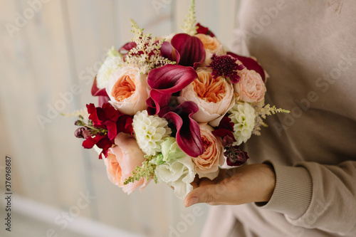 Burgundy feces, dahlias, peony roses of David Austin Juliet, white eustoma, burgundy antirinum, astilbe, scabiosa photo