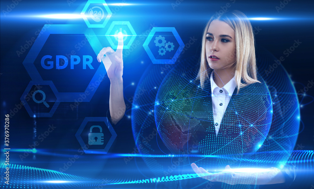 Business, Technology, Internet and network concept. Young businessman working on a virtual screen of the future and sees the inscription: GDPR Business, Technology, Internet and network concept. Young businessman working on a virtual screen of the future and sees the inscription: GDPR