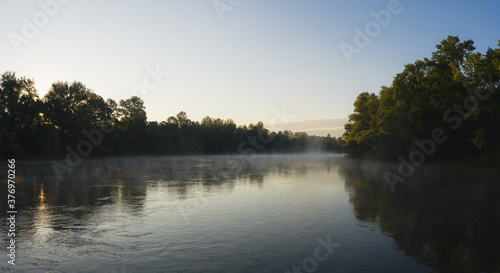 Aerial view of foggy Kupa river during an early morning, Sisak, Croatia.