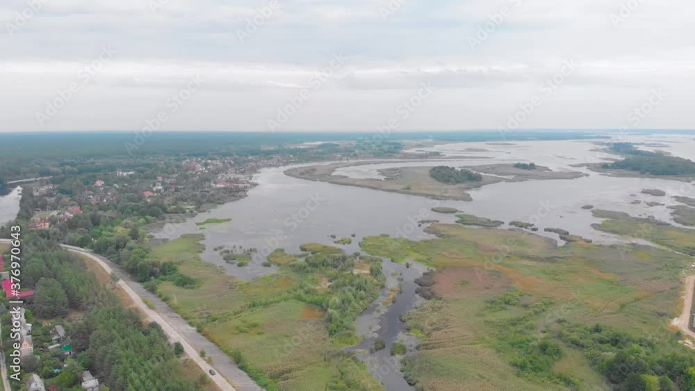 River valley bank suburb private houses on the shore drone left side camera movement River valley bank suburb private houses on the shore drone left side camera movement