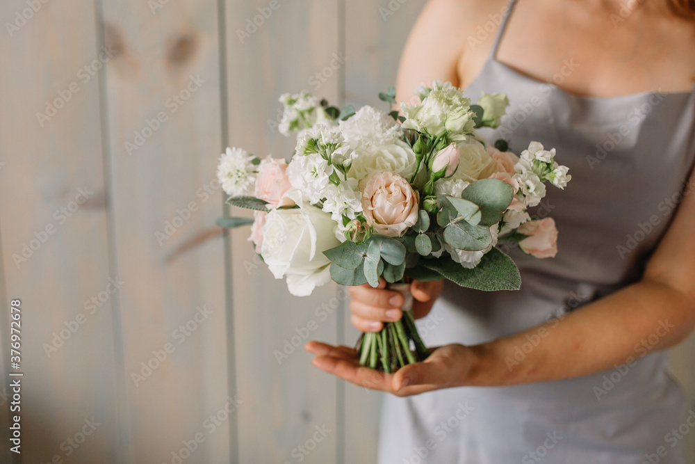 The original bouquet of flowers in the hands of women The original bouquet of flowers in the hands of women