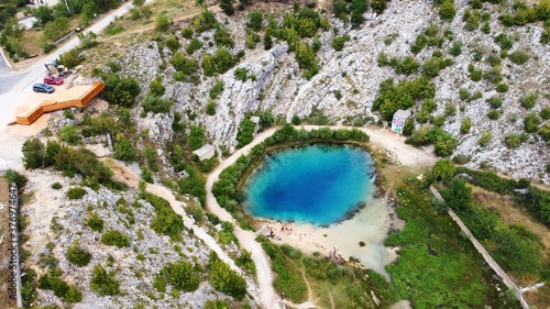 Source Of The River Cetina, Croatia, aerial view. Unique deep karst lake with clear blue water near Omis, Croatia.