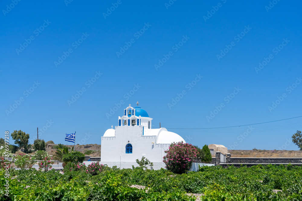 church in the village of akrotiri, santorini, cyclades, greece. blue sky