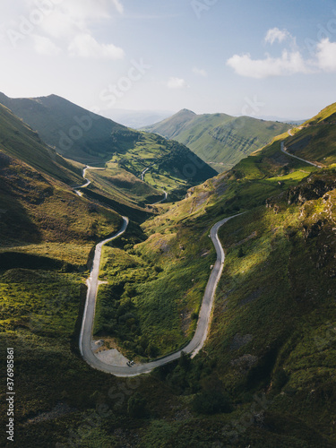Winding road up to the mountains in Valles Pasiegos Cantabria, Spain photo