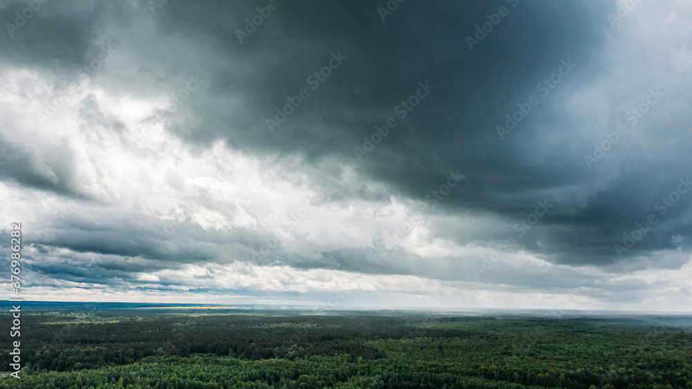 Scenic Sky With Rain Clouds Over Green Forest Landscape. Spring Summer Rainy Weather Scenic Sky With Rain Clouds Over Green Forest Landscape. Spring Summer Rainy Weather