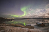 Northern lights in Tromso norway over wooden house