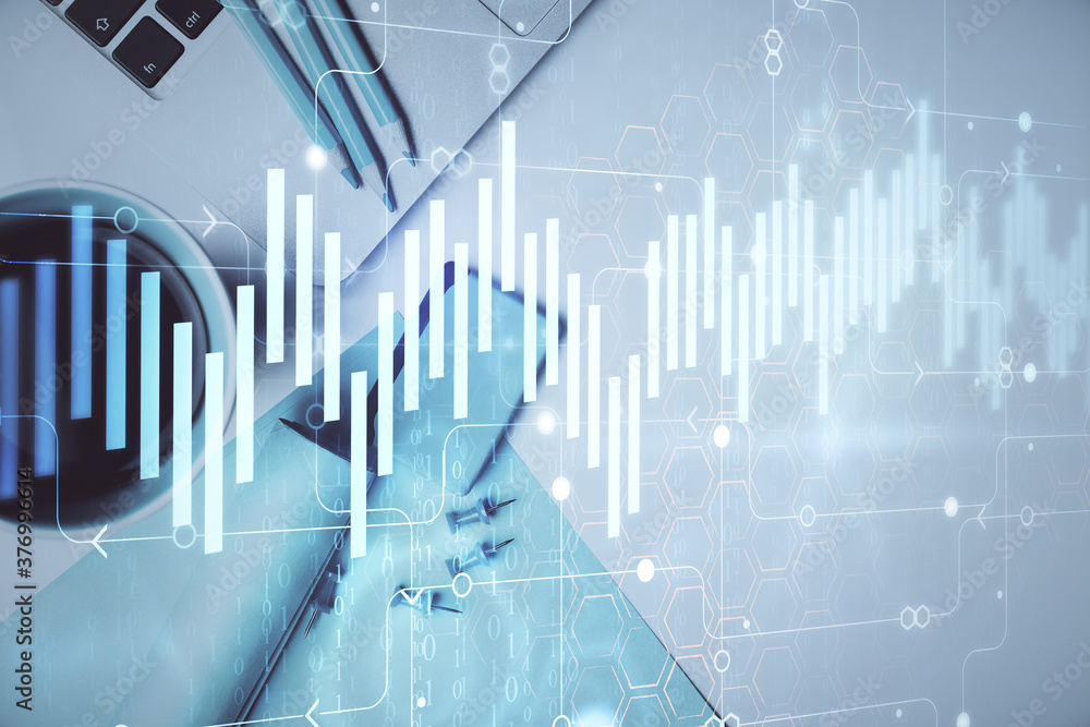 Double exposure of forex graph drawing over desktop background with computer. Concept of financial analysis. Top view. Double exposure of forex graph drawing over desktop background with computer. Concept of financial analysis. Top view.