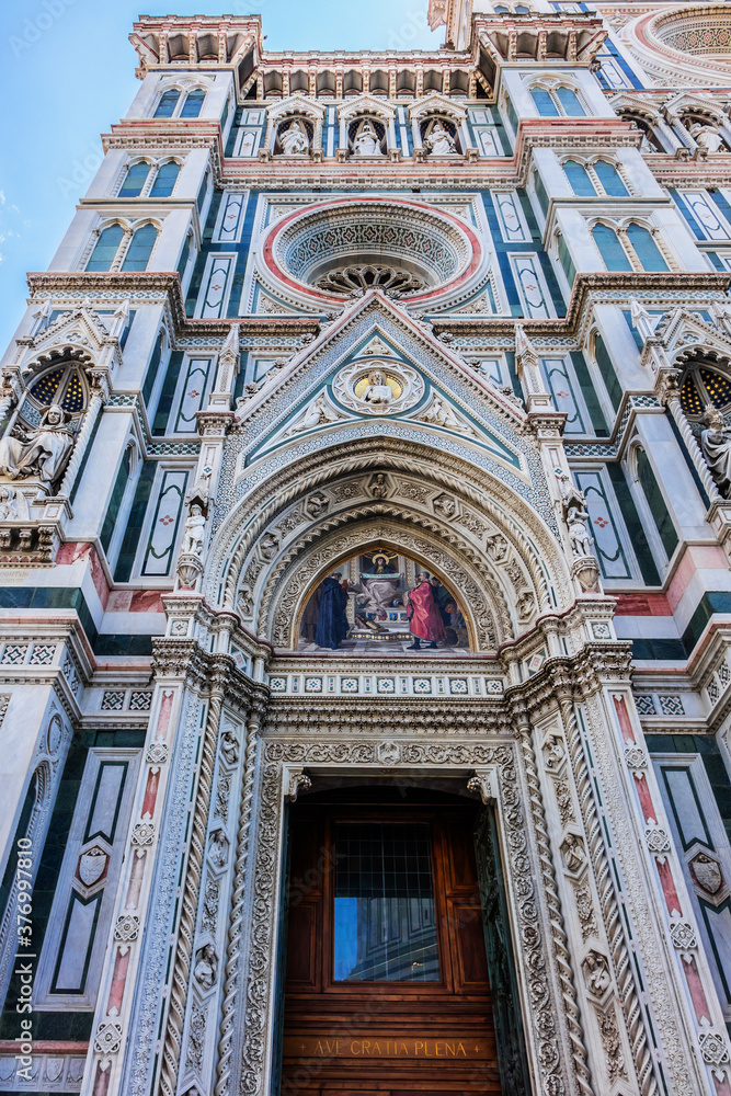 Cathedral Santa Maria del Fiore (or Duomo di Firenze), was built between 1296 and 1436. Cathedral is one of largest in world. Architectural fragments of front facade. Piazza del Duomo, Florence, Italy