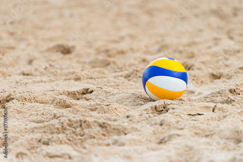 Photography Beach Volleyball. Game ball on beach sand. Team sport concept