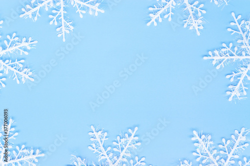 Snowflakes on a blue background. New Year concept. Flat lay. photo