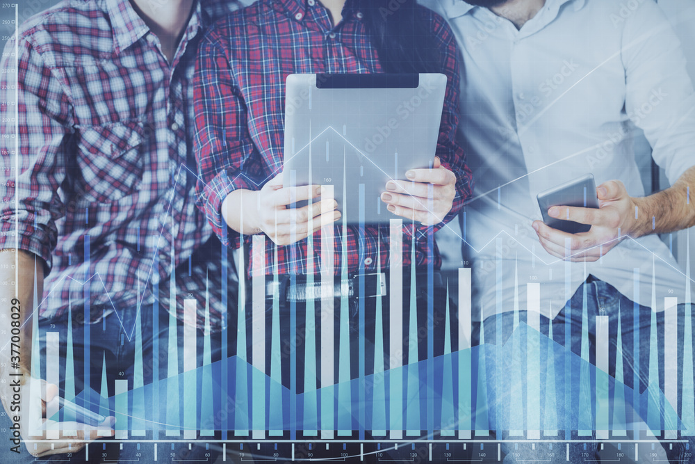 Double exposure of forex graph drawing and man and woman working together holding and using a mobile device. Trade concept. Double exposure of forex graph drawing and man and woman working together holding and using a mobile device. Trade concept.