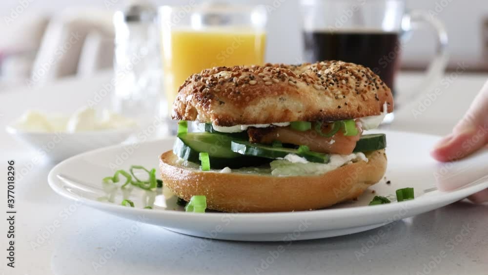 Serving a Bagel Sandwich with Cucumbers Serving a Bagel Sandwich with Cucumbers