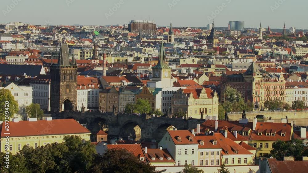 The monument of Charles Bridge in the center of Prague on the Vltava river and the surrounding architecture in the center of Prague The monument of Charles Bridge in the center of Prague on the Vltava river and the surrounding architecture in the center of Prague