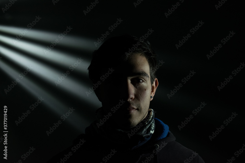 Young man in social media coat, dark concept of male depression, positive campaign, man advertising